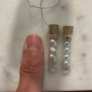 Loose pearls four round pearls, and three oblong pearls great for crafting